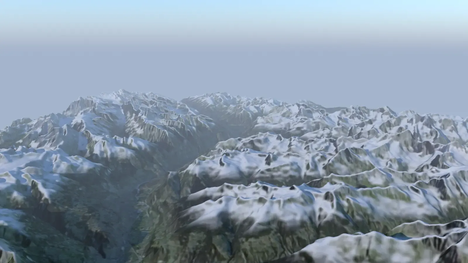 Un massif alpin en relief, vu du ciel à la fin du jour : une grande vallée file entre les montagnes, les hauteurs sont enneigées, les fonds de vallée restent verts et la distance se perd dans une brume claire.